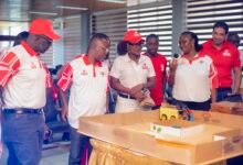 Officials at the exhibition looking at some of the projects on display