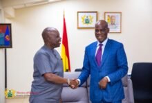 • Mr Haruna Iddrisu (right) welcoming Dr Wilfred Ochan to his office