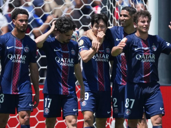 • Players of PSG join Kang-In Lee (3rd left) to celebrate his goal