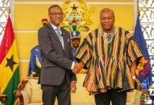 • President John Mahama (right) in a handshake with Lincoln George Downer, High Commissioner of Jamaica