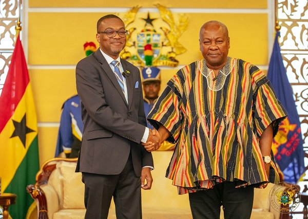 • President John Mahama (right) in a handshake with Lincoln George Downer, High Commissioner of Jamaica