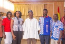 Mr Ali Adolf John Mburidiba in a white smock with the leadership of the Ghana Medical Association