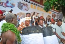 • Nii Dr Ayi-Bonte II (middle) drumming to lift the ban on drumming and noise-making