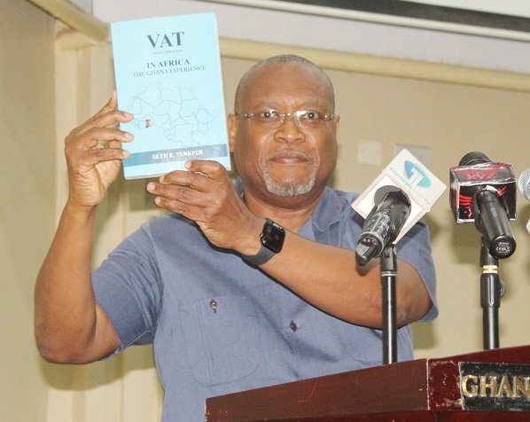 • Dr Alex Segbefia (inset) launching the book Photo: Ebo Gorman