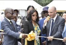 • Mr Cromwell Awadey (left), Executive Director, International Needs Ghana, Chriselle Formedi (middle) and Mr Zakaria Boughalem members of the GEMBA 2024 cohort cutting the tape to commission the project