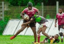 • Skolars’ Emmanuel Acheampong with the ball comes under a challenge from a Dragons defender