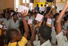 Some female students holding thier sanitary pads