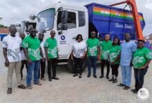 • Some officials of Zoomlion by one of the trucks