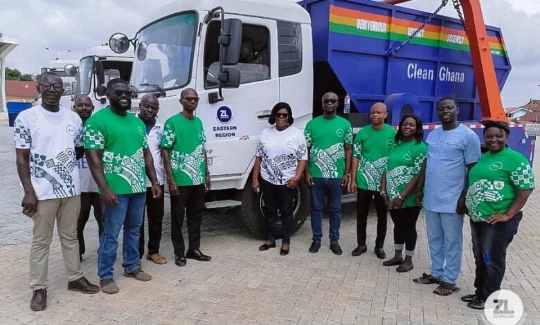 • Some officials of Zoomlion by one of the trucks