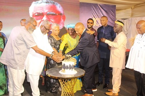 • Nana Konadu Agyeman-Rawlings (middle), Mr Jeffrey Peck (in suit) and other guests cutting the W.E. B. Dubois anniversary cake Photo: Ebo Gorman