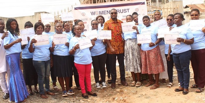 Mr Willibald Kafui Duho (middle) with the graduands showing their certificates after the graduation ceremony Photo: Ebo Gorman