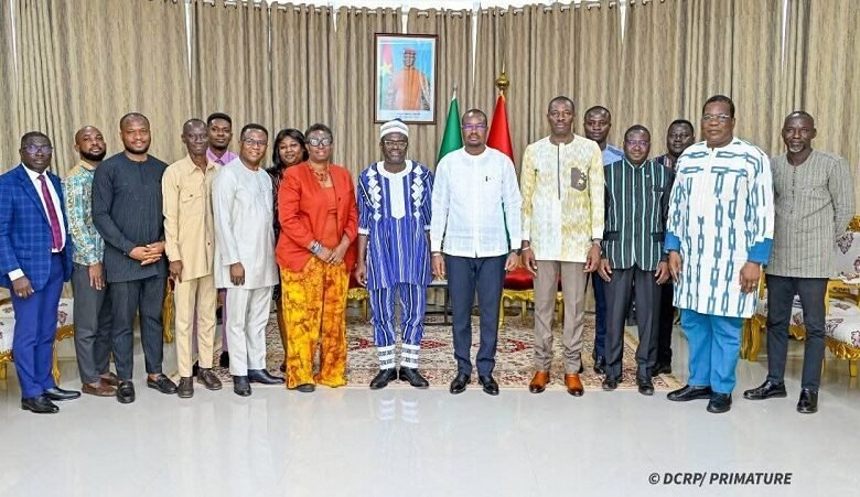 • Dr Joseph Siaw Agyepong and Mr Rimtalba Jean Emmanuel Ouédraogo (middle) with other officials after the meeting
