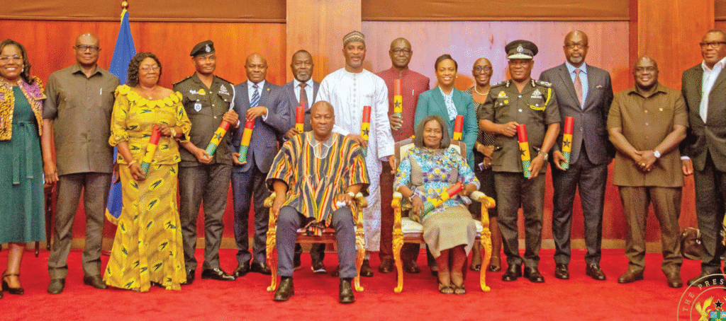 President Mahama and Vice President Prof. Naana Jane Opoku-Agyemang (seated) with the police council members after the inauguration