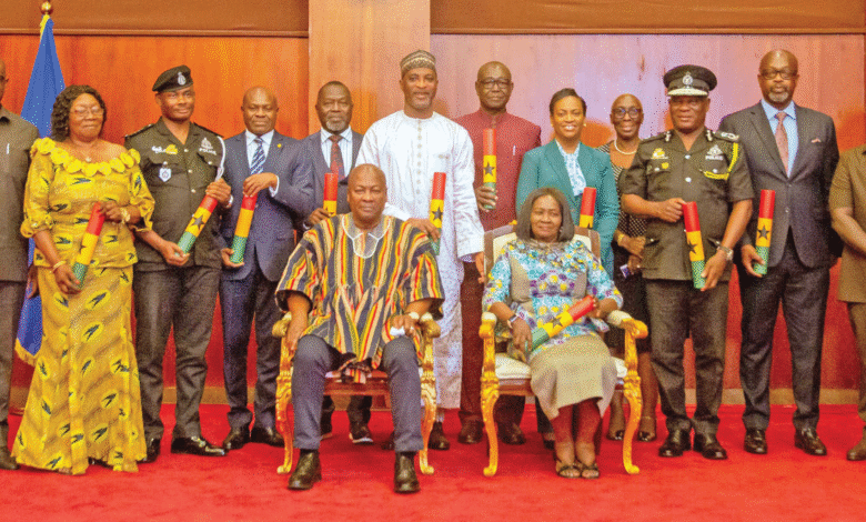 President Mahama and Vice President Prof. Naana Jane Opoku-Agyemang (seated) with the police council members after the inauguration