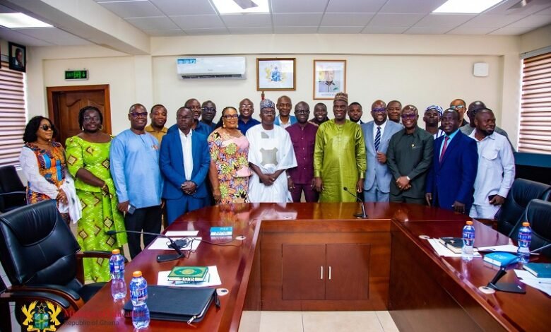 Haruna Iddrisu (in caftan) with members of the board