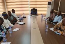 • Dr. Sulemana, PURC Executive Secretary, Mr Donatus Atanga Akamugri, other participants at a meeting at the RCC.