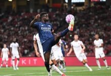 Bukayo Saka traps a ball during the game