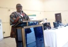 • Professor Kwesi Prempeh (inset) speaking at the programme