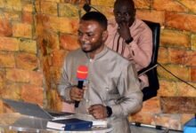 Dr Daniel Fobi addressing the congregation