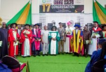 • Mr Krakraba (Right) briefing the Minister and his team (left) (Extreme Rigt) Contractors working on one of the storm drains