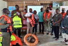 • Mr. Aguddey (third left) educating the community members on the proper use of the life jackets