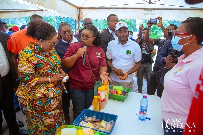 • Mrs Lordina Mahama (left) being briefed at the programme