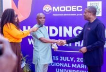 • Mr Ahwireng (right) presenting keys to Dr Brooks