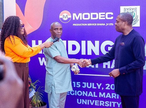 • Mr Ahwireng (right) presenting keys to Dr Brooks