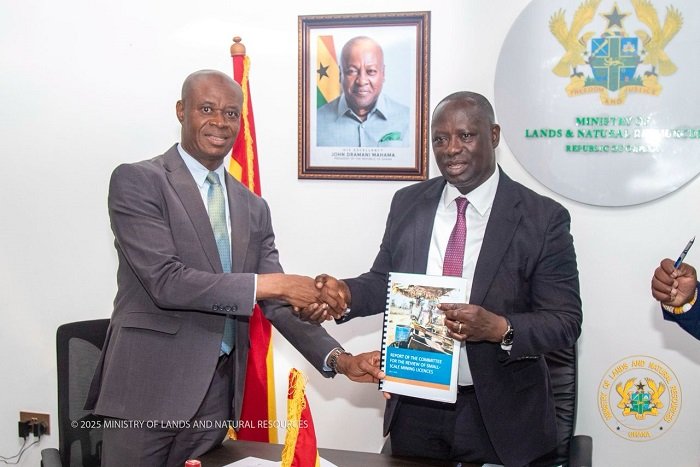 Emmanuel Armah-Kofi Buah (right) receiving the report