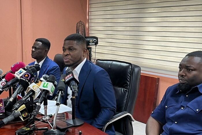Mr Sammy Gyamfi (middle) addressing the press