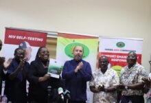 • Nana Oye Bampoe Addo (second from left) displaying a copy of the report. With her are other dignitaries