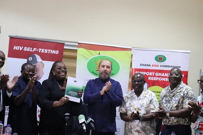 • Nana Oye Bampoe Addo (second from left) displaying a copy of the report. With her are other dignitaries