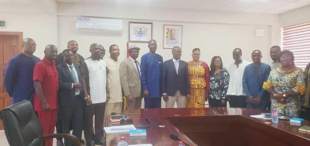 Mr Haruna Iddrisu (seventh from right) with the newly inaugurated NTC Board