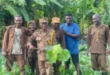 • DDP James Mwinyelle (second from left) with his men on the farm