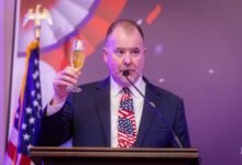 • Mr Rolf Olson proposing a toast at the celebration