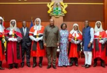• President Mahama (middle) and Vice President Naana Jane Opoku-Agyemang with the judges after the swearing in