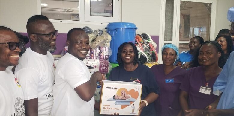 Mr Rexford Jones Bafoe (first left) presenting the items to Ms Elizabeth Koranteng