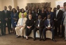 Mr Stefanos (seated left) with some dignitaries at the forum