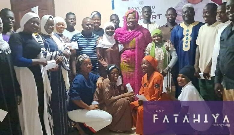 • Hajia Fathahiya Abdul-Aziz (middle) with the beneficiary students