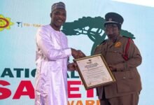 • Mr Mohammed-Mubarak presenting a citation to CFO Sapong