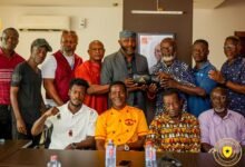 • Mr Yaw Ampofo Ankrah receiving boxing gloves presented to him by the GBA executive board