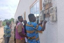 • NEDCo staff disconnecting Ghana National Ambulance service power