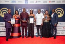 Officials of the bank displaying the awards