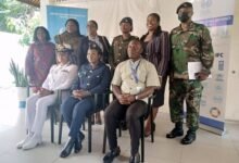 Squadron leader Syme (middle) with other dignitaries after the programme