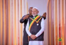 • President Mahama decorating Indian Prime Minister Narendra Modi at the meeting