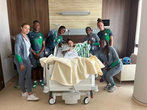 • Players of the Super Falcon with Salgado after her surgery