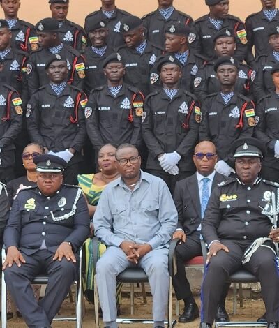 • Mr Roland Atanga Ayoo, MCE for Bolgatanga (in suit) with the senior police officers and the newly recruits