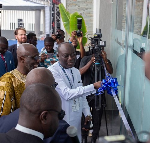 • Mr Ebrima Sillah supported by other dignitaries to cut the tape for the inauguration of the centre