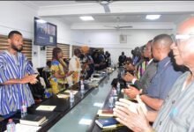Mr Ahmed Ibrahim (middle, far end) inagurating the board excellence. members of LUPSA and ILGS Photo: Seth Osabukle
