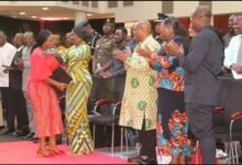 Vice President Professor Naana Jane Opoku-Agyemang embracing Mrs Charlotte Osei (infront) after her lecture. Applauding include Mr Alex Segbefia and Ms Nana Oye Bampoe Addo. Photo. Ebo Gorman
